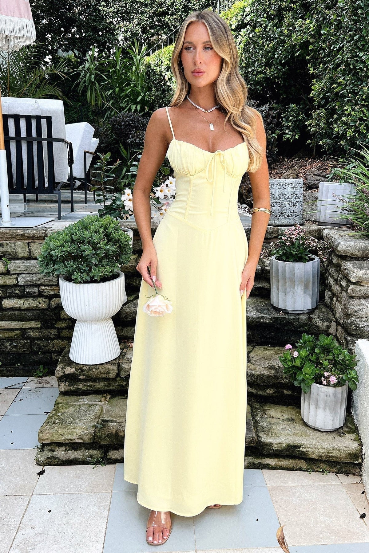 Sleeveless lace-up maxi dress with a flowing silhouette, adjustable lace-up front, and breathable fabric—perfect for elegant and casual occasions.